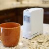 Inogen One G4 Portable Oxygen Concentrator Next to Coffee Mug