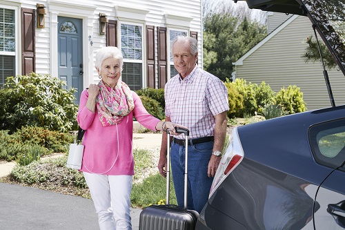 Couple with Inogen One G4 Portable Oxygen Concentrator Getting Ready for Car Trip