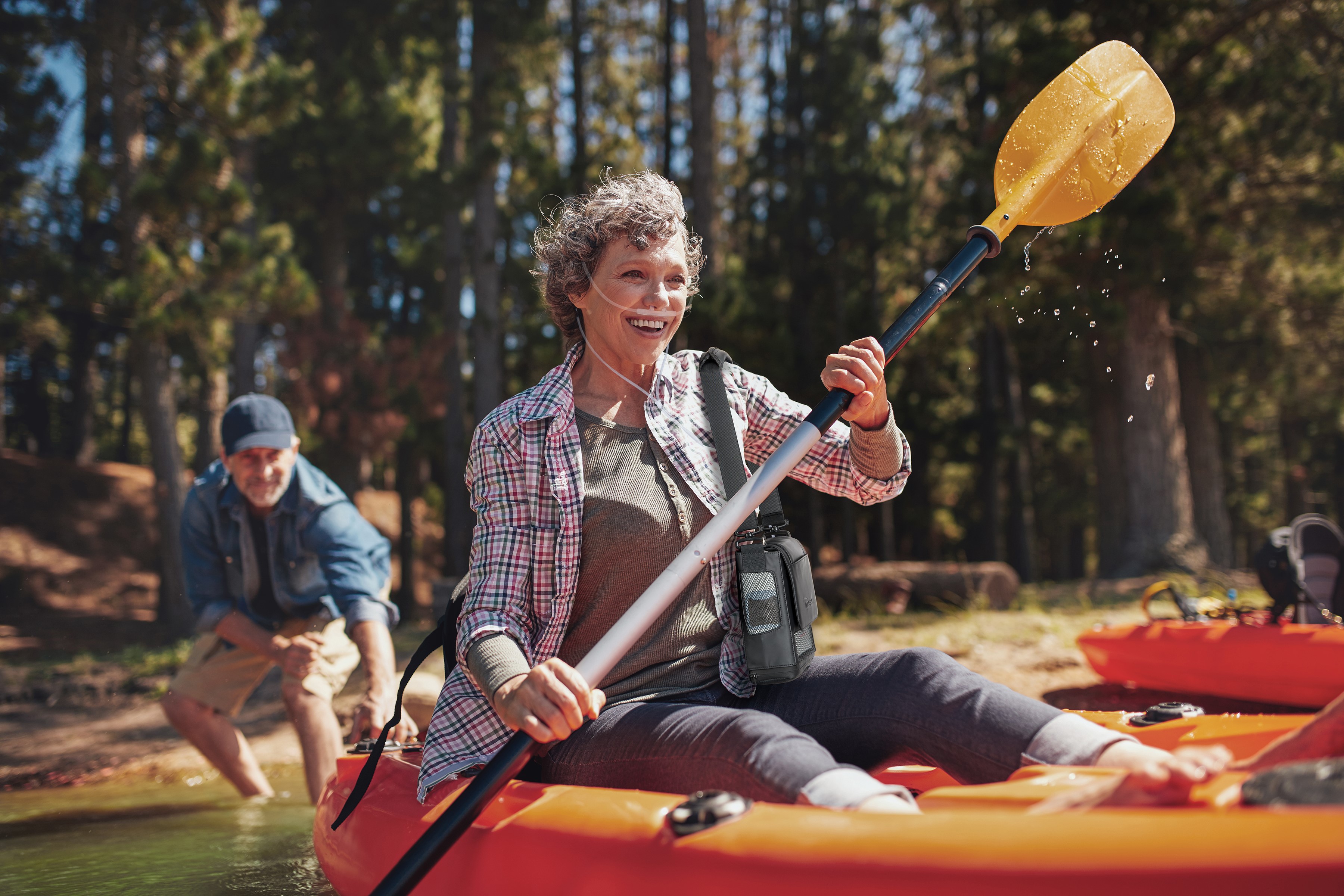 Woman kayaking with Inogen One G5