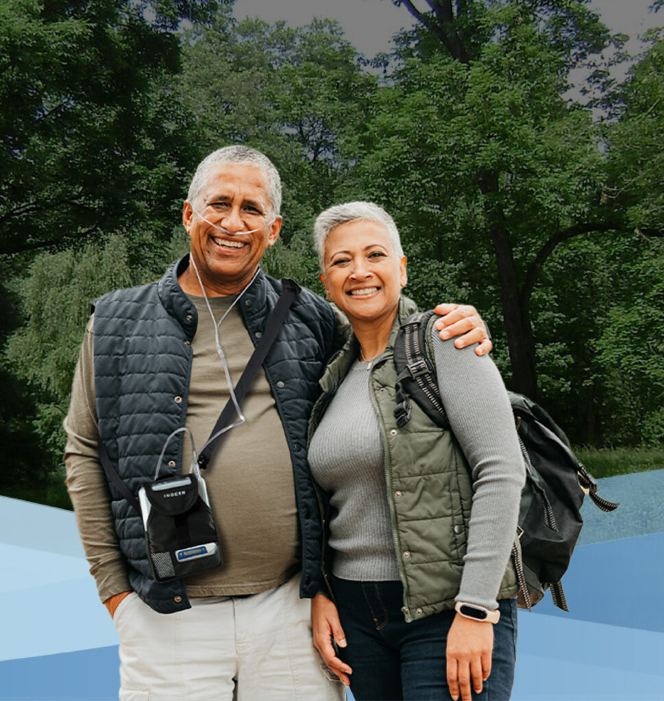 Grandma and granddaughter posing with Inogen Portable Oxygen Concentrator