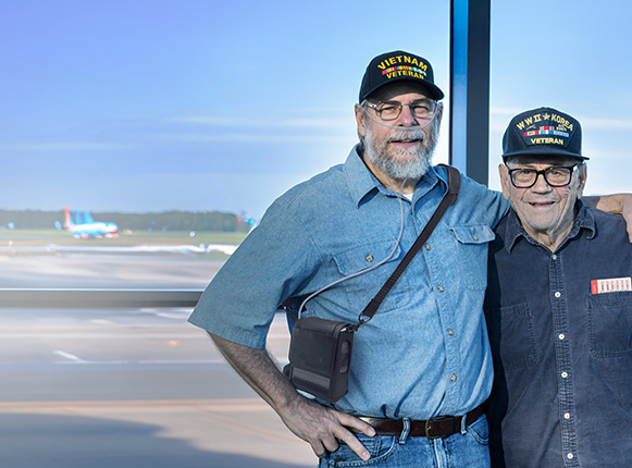 Veterans at an airport with the Inogen Rove 4